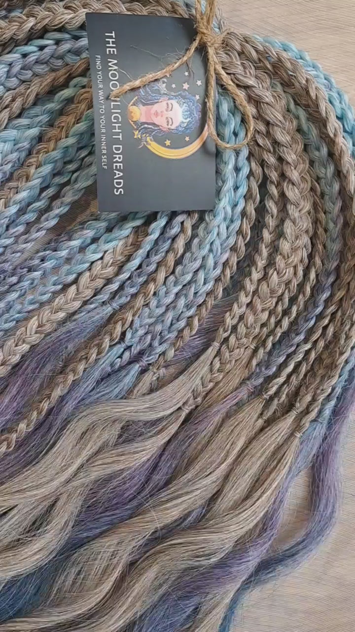 Soft, lightweight, and reusable double ended synthetic brushable curls. Ombre from ash to platinum blonde, and a cool transition from dusty blue into lavender and navy blue.