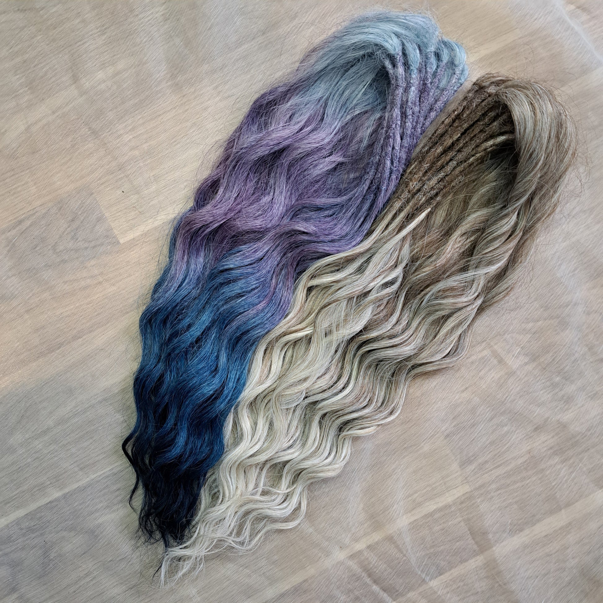 Soft, lightweight, and reusable double ended synthetic brushable curls. Ombre from ash to platinum blonde, and a cool transition from dusty blue into lavender and navy blue.