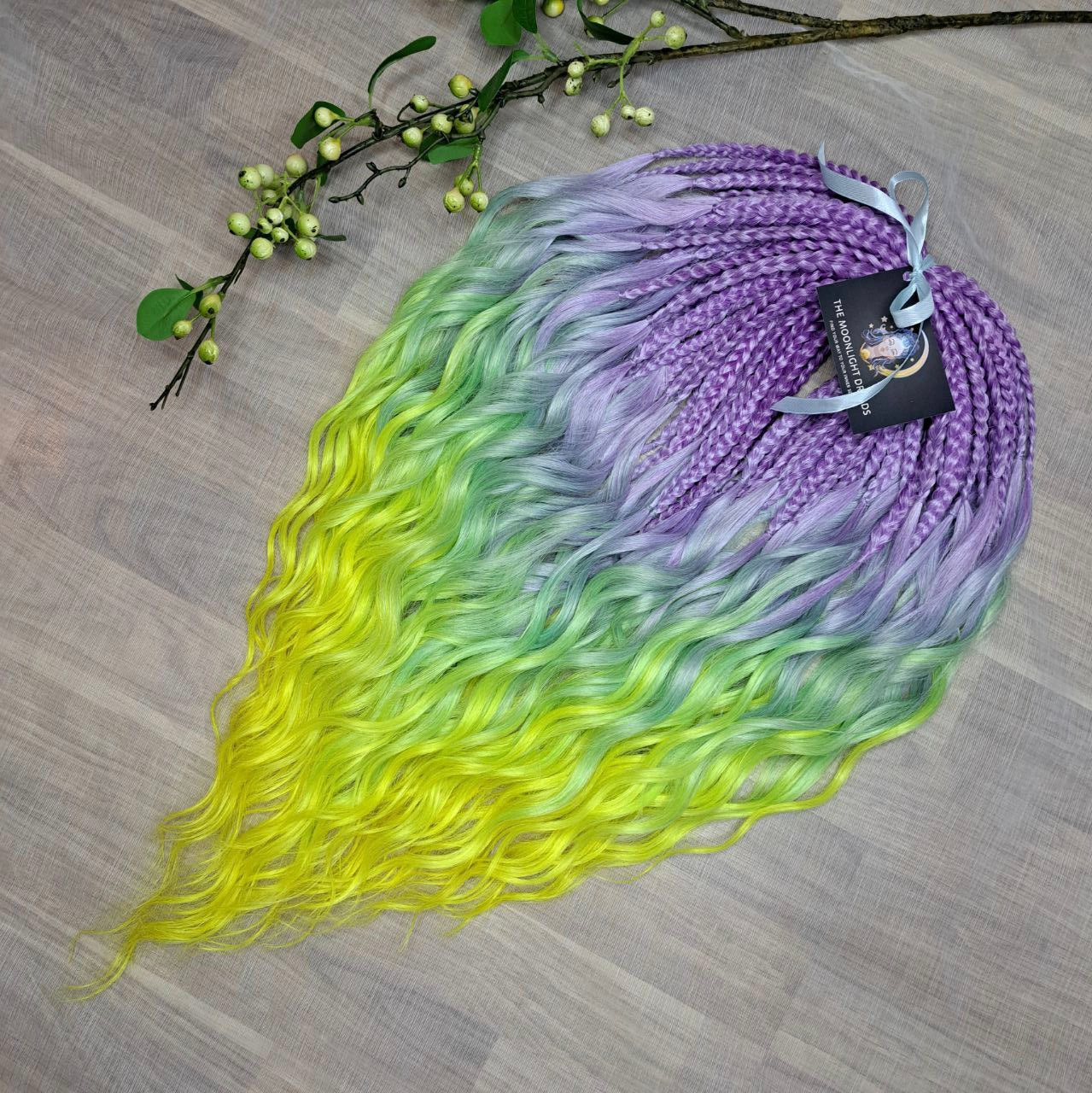 ombre from purple/lavender to light green and yellow brushable curls with braided middle 