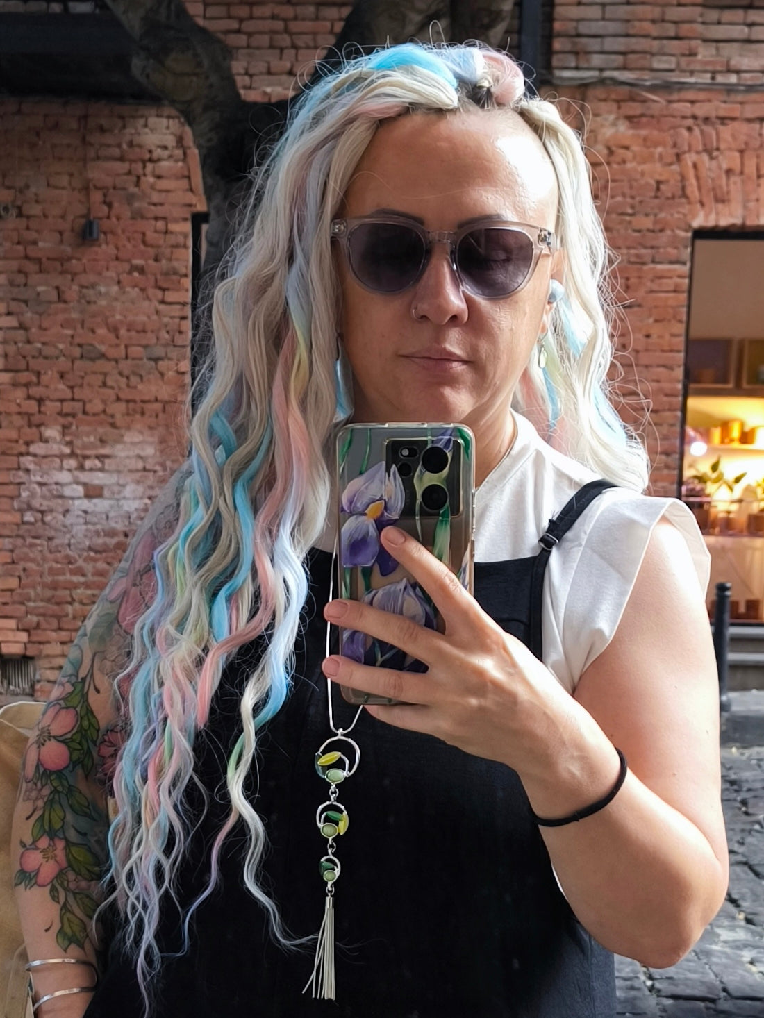 Cotton Candy - soft, lightweight, and reusable double ended synthetic brushable curls. A blend of platinum blonde, sky blue, pink, and rainbow colors creates a light, airy look full of soft color transitions.