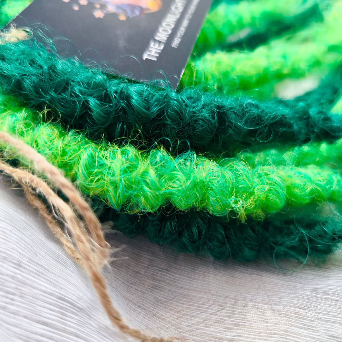 Emerald Moss - a mix of emerald and neon green. Soft, lightweight, and reusable synthetic double ended NON-BRUSHABLE curls